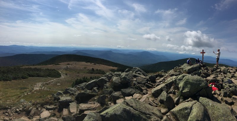 View from the summit, summit sign marker to the right of the photo.