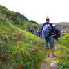 Hiking up through Windmill Canyon on Cherry Canyon Trail. Note paintbrush flowers and singletrack trail.