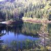 Cast Lake, is being reclaimed by meadow and forest has nice campsites on the northeast side of lake.  Photo by Seana Bennett.