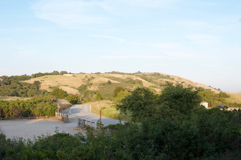 The trail rises above the parking lot offering some of the best views of the Open Spaces in the areas.