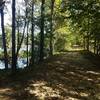 Nice wide trail starting off on a land bridge between two bodies of water.