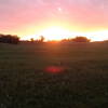 Sunset over the prairie covered sandhills.