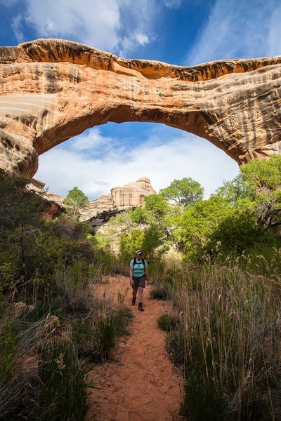 Hiking beneath Sipapu Bridge. Photo Credit: NPS Photo / Jacob W. Frank.