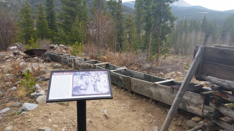 Interpretive sign and sluice box.