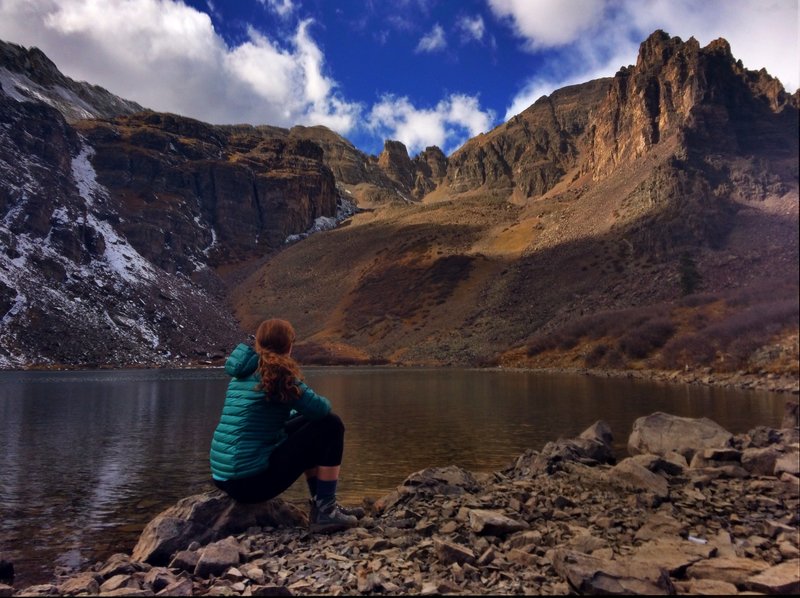 Taking in the view of Cathedral Peak on a peaceful fall day at Cathedral Lake.