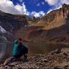 Taking in the view of Cathedral Peak on a peaceful fall day at Cathedral Lake.