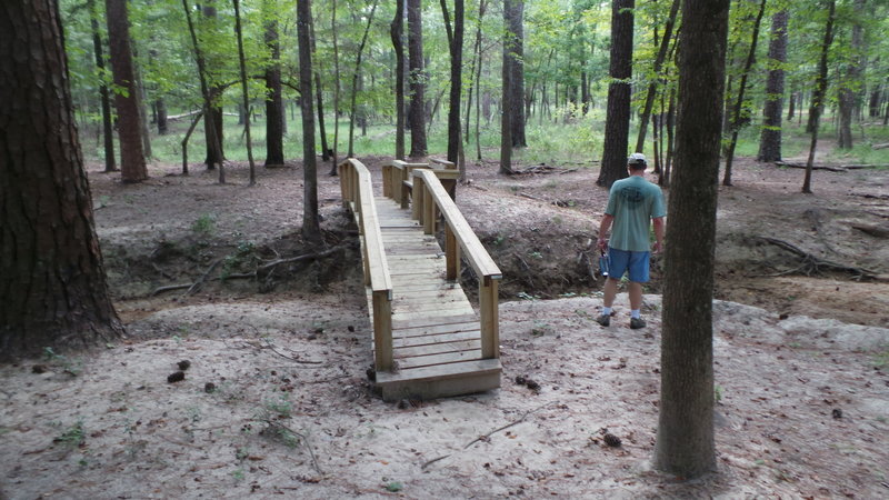 Looking at flood damage before crossing the bridge.