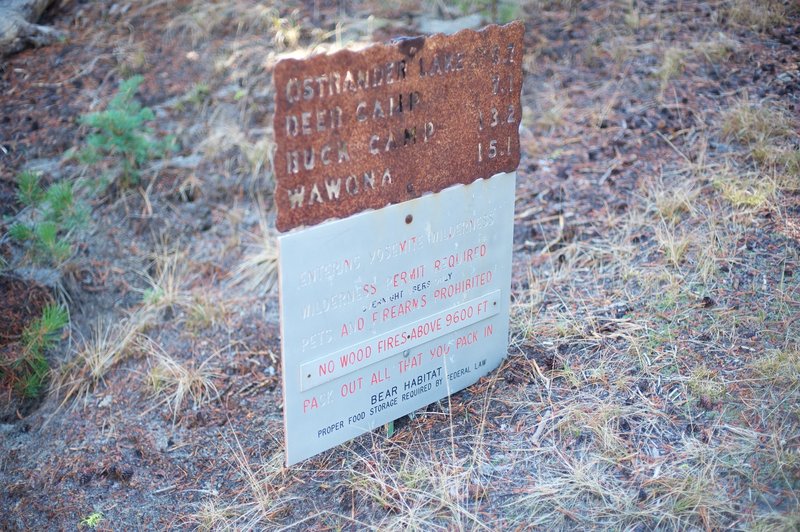 Sign at the trailhead indicating how far it is to various Yosemite destinations.