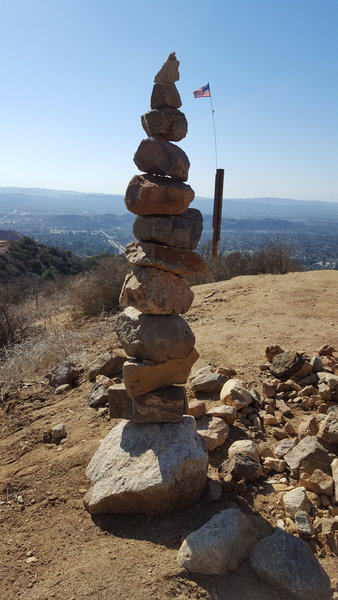 A tall cairn marks the trail.