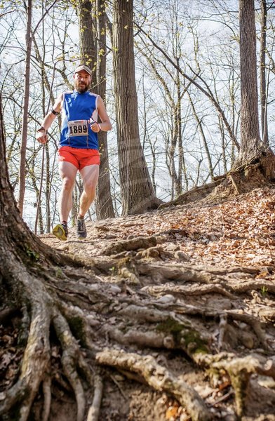 Chris O'Brien from the Running Inside Out Podcast bombing the downhills at Medved Madness Trail Run. (Photo by Ron Heerkens Jr Photography.)