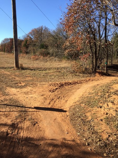 The end of the orange trail is at the end of the south power line road. Stay on the singletrack green trail. You have 2 more mile to go and you'll be back on the south power line road.