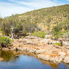 The Swan River flowing through over through the scenery.