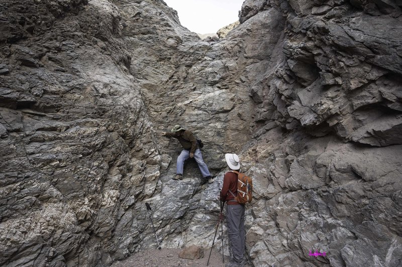 Climbing the dry waterfall near the end of the trail.