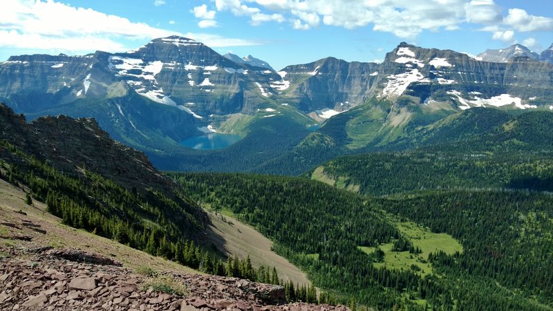 Chapman Peak (furthest left), Lake Wurdeman, Lake Nooney, and Mt. Custer (furthest right) rise among a sea of peaks when looking south from the shoulder of Mt. Carthew.