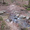 Crossing the Auxier Branch Creek is both scenic and easy.