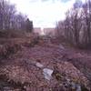 An overhead view of the narrow, rocky passes that run alongside the Raven Rock Trail on the Raven Rock - Alternate Trail. There are trees and bushes growing in these narrow passes.