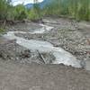 Stay back from the edge of the riverside cliffs along the Sandy River Trail, as they are unstable, sandy overhangs. The river moves considerably from year to year. Photo by USFS.