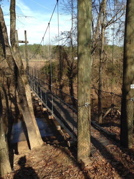 A suspension bridge provides easy passage over Adams Creek.