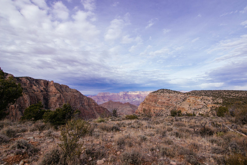 Desert View Watchtower is off to the left. The view is looking north to the Grand Canyon from the trail descending from the tower.