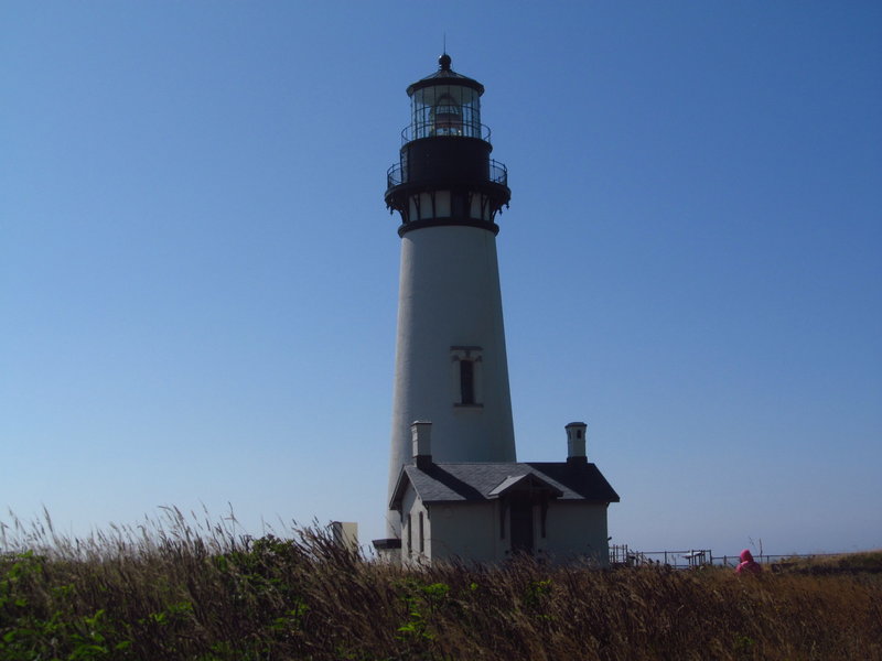 Yaquina Head Lighthouse ushers vessels safely into harbor off the coast of Agate Beach.