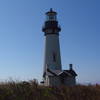 Yaquina Head Lighthouse ushers vessels safely into harbor off the coast of Agate Beach.