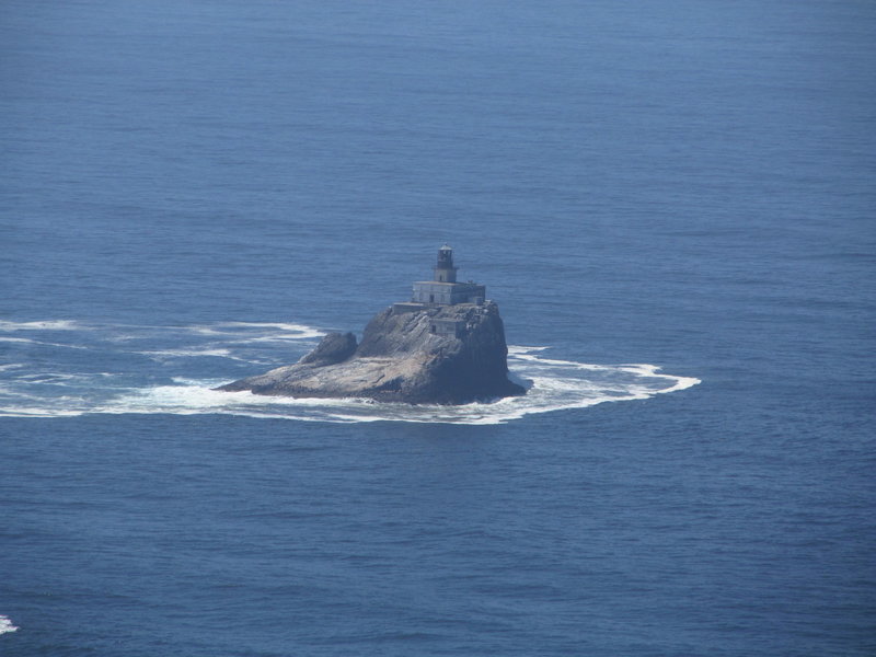 Tillamook Rock Lighthouse stands prominently off the coastline.