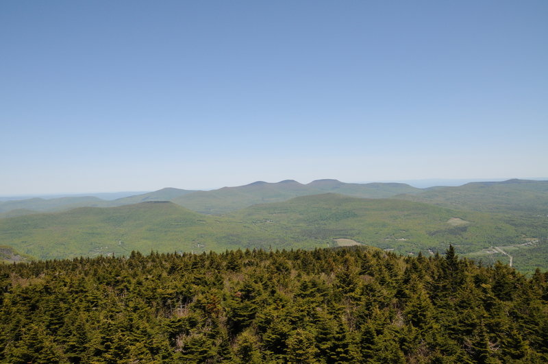 Hunter Mountain's summit fire tower offers phenomenal views toward Thomas Cole, Black Dome, and Blackhead Mountain.