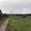 The trail follows the fence line of the cemetery and power lines leading to a PG&E substation.