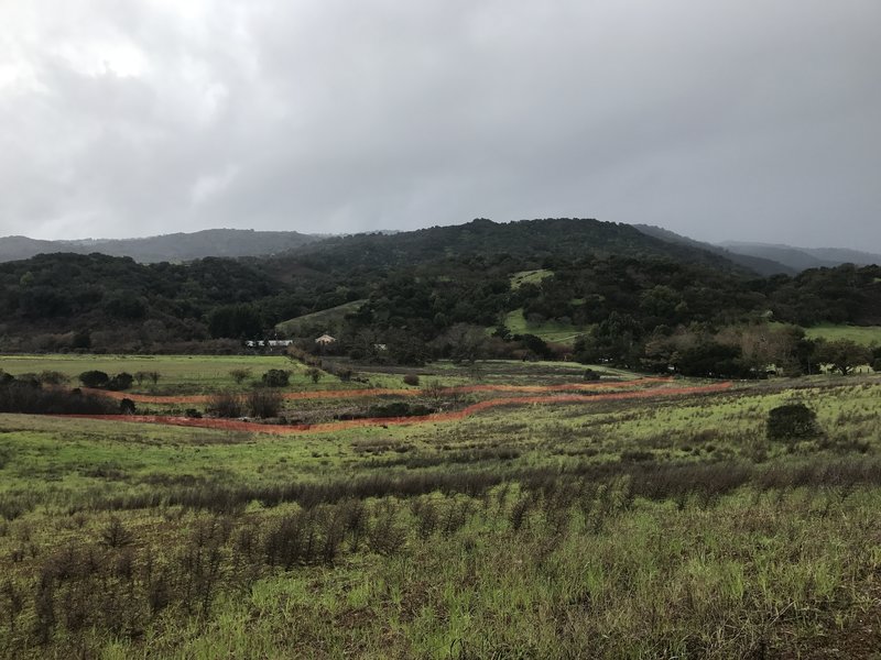 The trail re-enters Rancho San Antonio, and views of the hills above the preserve come into view.