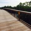 A boardwalk bridge travels over the Gordon River on the Gordon River Greenway.