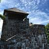 Wayah Bald Fire Tower stands watch over dense forests and clouded skies.