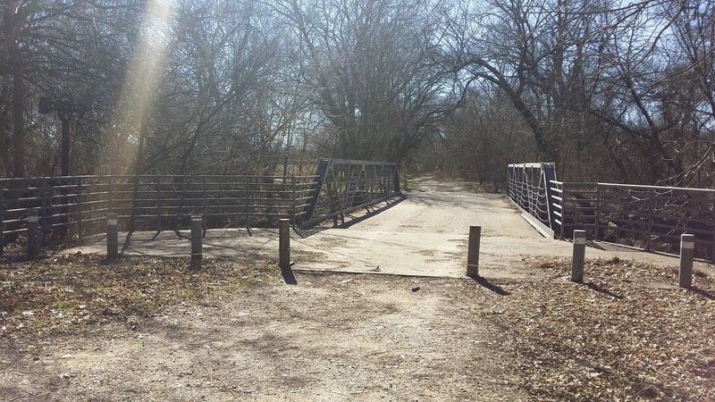 Cross this bridge just before the entrance to the meadow.