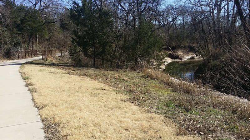 The trail follows along the creek in this section.