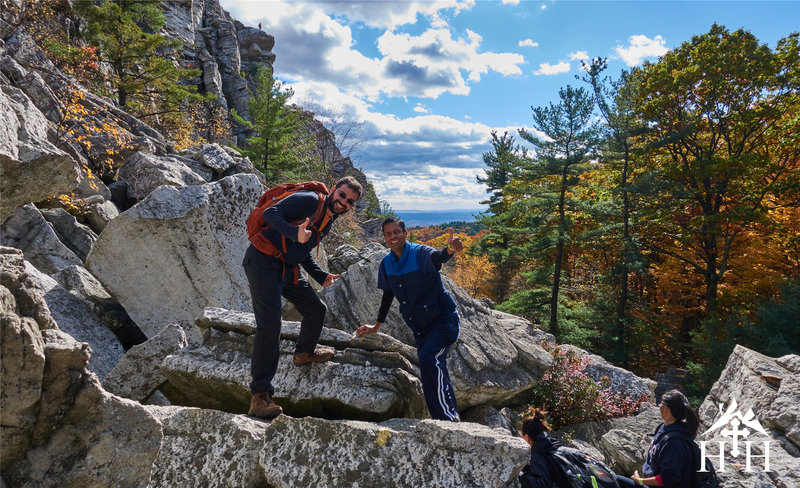 The group's still smiling as we make our way up the scramble.