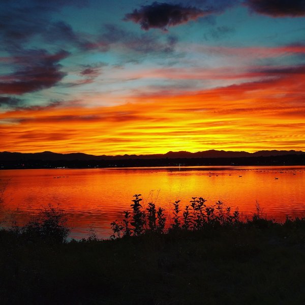 The sun sets at Sloan's Lake Park.