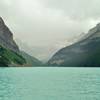 Lake Louise poses with Victoria Glacier at its far end and Mt. Victoria hidden in the clouds.