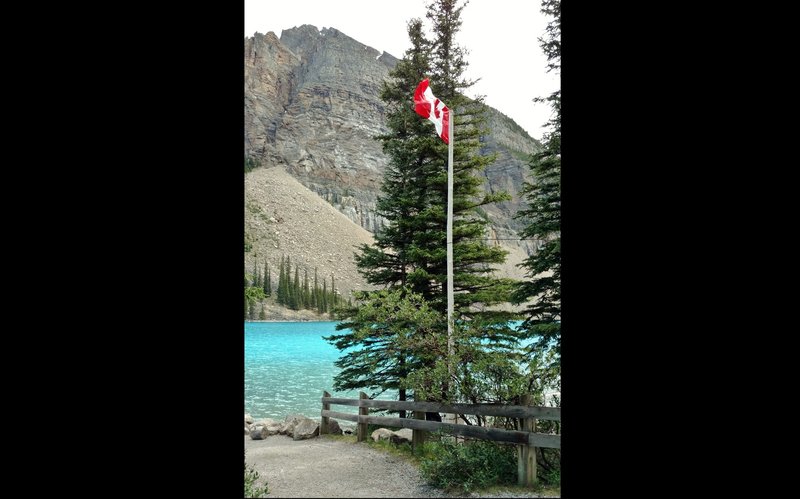 The Tower of Babel (right portion) stands on the opposite side of Moraine Lake from the walking path.