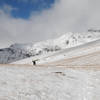 My friend nears the top of the shoulder on a snowy but beautiful day.