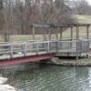 A bridge provides access across the lake.