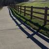 The trail is beautifully paved as it heads toward the golf course.