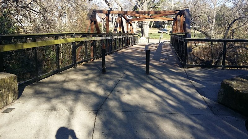 This sturdy footbridge connects the trail to the parking lot.