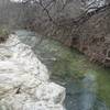 Rowlett Creek gurgles below as you pass over it on the bridge.