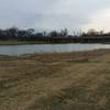 This small lake passes under Renner Road.