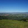 Enjoy expansive views of the valley from the top of the hill near the picnic bench.