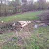 A pile of debris offers access across the wet ditch to the north end of the Addicks-Fairbanks Trail.