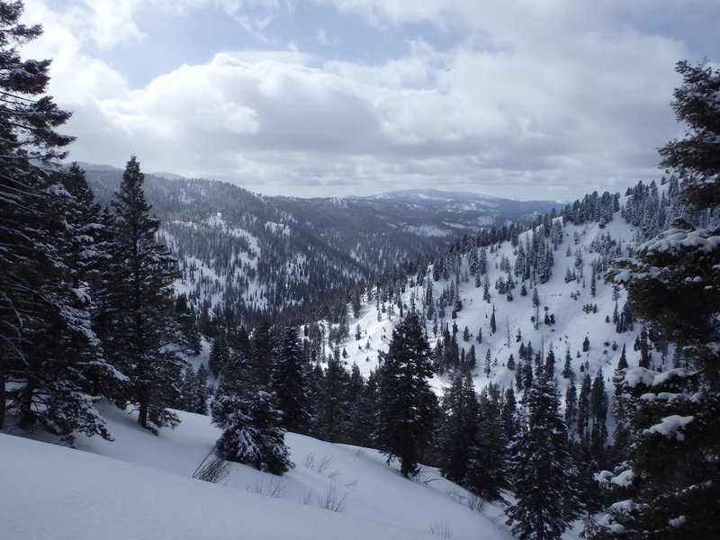 A heavy blanket of snow covers the hills around Summit Flat Road.