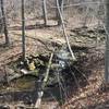 A smaller waterfall flows along the Sagamore Creek Loop Trail.