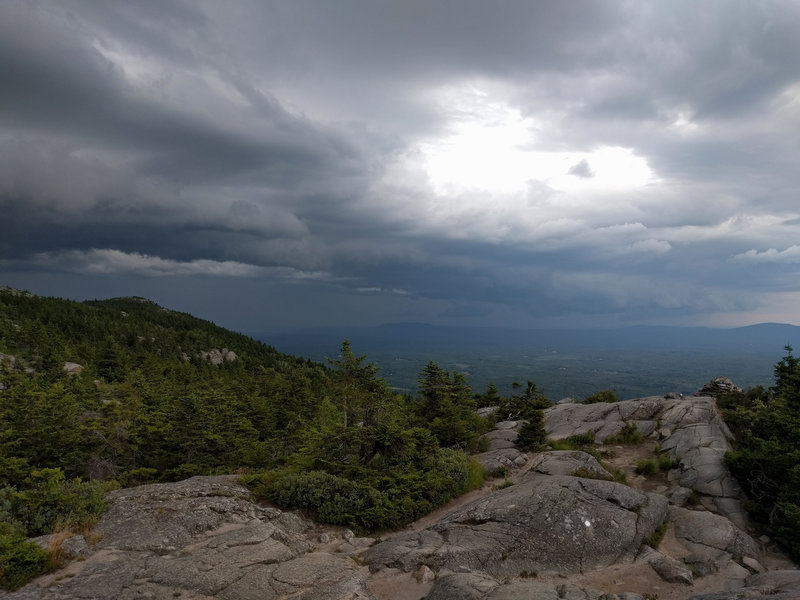 Storm clouds rolling in from the north at Three Quarters Ledge on the White Dot Trail.