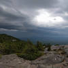 Storm clouds rolling in from the north at Three Quarters Ledge on the White Dot Trail.