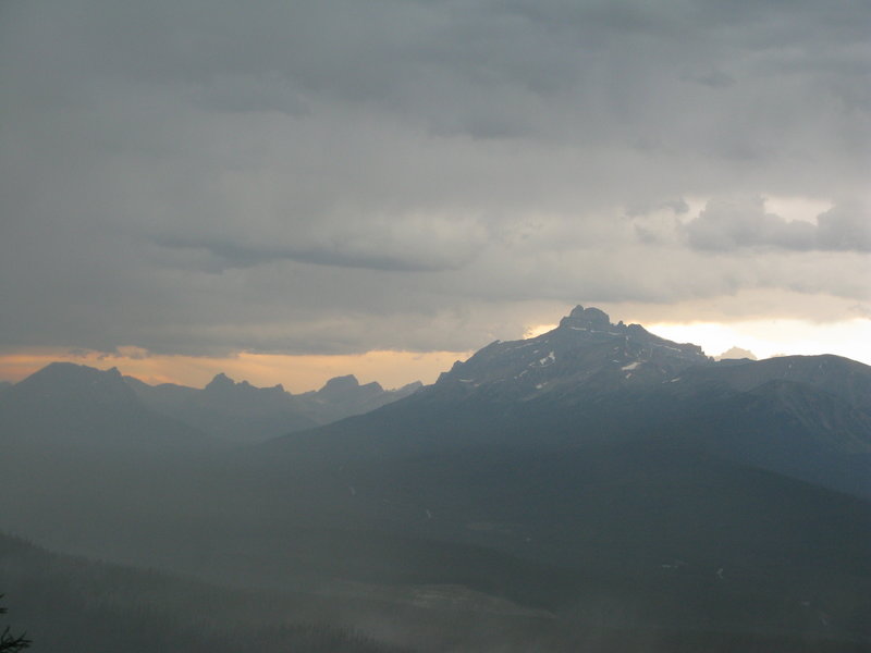 A storm rolls through the valley below the Saddleback Trail.